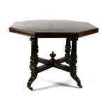 A Victorian mahogany centre table with octagonal top, on carved architectural columns, 105cms wide.