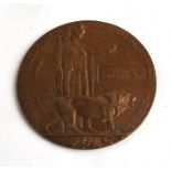 A WWI bronze death plaque named to 'Thomas Augustus Sims'.