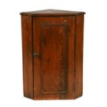 A small pine wall hanging corner cupboard, 48cms wide.