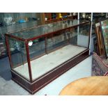 A large antique shop counter display cabinet with one internal shelf. 182cm long, 64cm deep 88cm