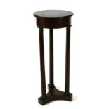 A French Empire style mahogany plant stand, 36cms diameter.