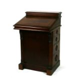 A Victorian mahogany Davenport style clerk's desk with fall-front opening to reveal a fitted