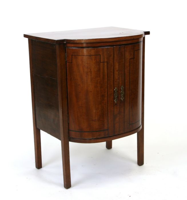 A mahogany bowfronted two-door side cupboard, on square legs, 56cms wide.