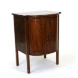 A mahogany bowfronted two-door side cupboard, on square legs, 56cms wide.