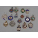 A quantity of silver and enamel watch fobs, various dates and makers, 141g.