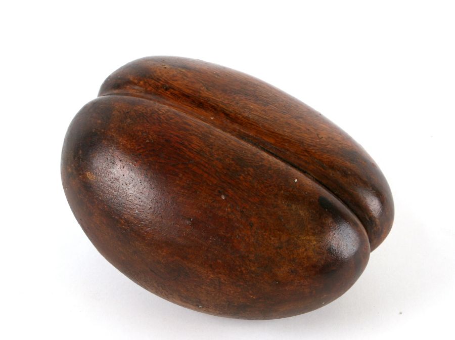 A treen carving in the form of a coco-de-mer, 20cms high.Condition ReportA couple of minor age