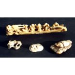 A Chinese carved ivory group of figures in a boat, 18cms long; together with three carved ivory
