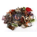 A large quantity of costume jewellery to include bangles and necklaces.