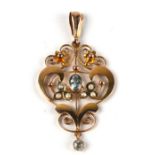 An Edwardian 9ct gold aquamarine and seed pearl pendant, 4.5cms high, 2.5g.