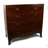 A 19th century mahogany chest of drawers with boxwood stringing, in the Sheraton taste, with two