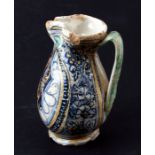 A Montelupo style armorial jug, the ovoid body painted with an octagonal panel enclosing a rampant