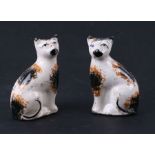 A pair of 19th century Staffordshire pottery cats.9.5cm high