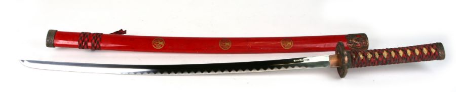 A contemporary Japanese Samurai type sword with red lacquer scabbard, 102cms long.