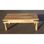A modern hardwood coffee table, 110cms wide.