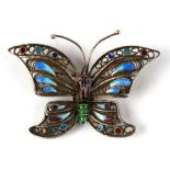 A silver gilt filigree and enamel butterfly brooch, 4.5cms wide.