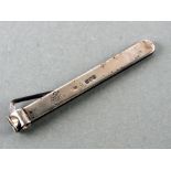 A large Victorian silver cigar cutter, London 1900, 15cms long.