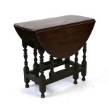 An 18th century style gateleg table of small proportions, 73cms wide.
