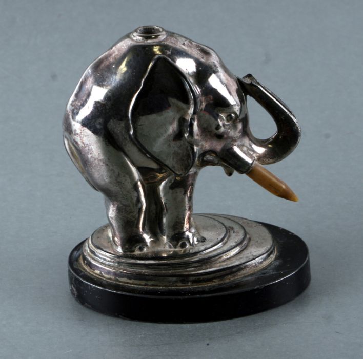 A vintage Ronson chrome plated table lighter in the form of an elephant ,10cms high (a/f).