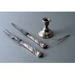 A Tiffany silver handled two-piece carving set; together with a silver dwarf candlestick and a