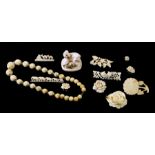 A group of early 20th century bone and ivory jewellery to include brooches and necklaces.