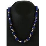 An Egyptian style graduated sodalite bead and silver necklace, cased.