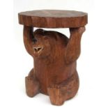 A Black Forest style carved wooden coffee table with bear support.