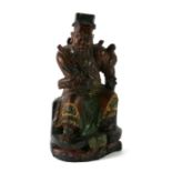 A Chinese carved wooden figure depicting Guan Yu, with polychrome decoration, 24cms high.