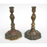 A pair of bronze Rococo style candlesticks, 24cms high.Condition ReportBoth bases have been drill to