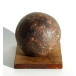 An 18th century cast iron cannon ball. Approximate diameter 11.5cms (4.5ins)
