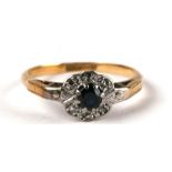 An 18ct gold diamond and sapphire cluster ring, approx UK size 'M', 2.5g.