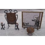 An Art Nouveau wrought iron and copper fire screen; together with a similar pair of fire dogs; a
