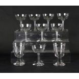 Eight 19th century cut glass hollow stem champagne glasses; together with a pair of etched