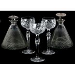 A three cut glass hock glasses, 19cms high; together with two cut glass ship's decanters, 19cms high
