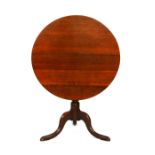 A 19th century mahogany snap-top tilt-top table with turned column and triform base with slipper