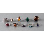 Ten assorted gem set silver rings to include an amber example, 52g (10).Condition ReportSeven are