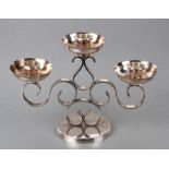 A Christofle silver plated three-branch candelabrum, 18cms high.