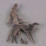 A silver Art Deco style brooch in the form of a lady walking a Borzoi, 11g.