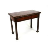 A 19th century mahogany tea table on square legs, 93cms wide.
