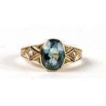 A 14ct gold ring set with a large oval aquamarine and diamond set shoulders, approx UK size 'N', 3.
