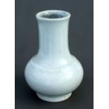A Chinese white crackle glaze vase with blue seal mark to the underside, 18cms high.