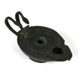 A Roman style lamp pastille burner with twin serpent handles, 17cms wide.