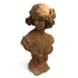 A well weathered cast bust of a young maiden, 63cms high.