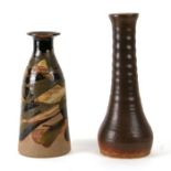 A Studio pottery vase, 25cms high together with another similar, 29cms high (2).