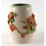 A Clarice Cliff Newport Pottery vase with relief floral decoration, shape no. 899L/S, 20cms high.