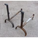 A pair of cast iron andirons.