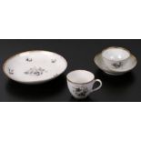 A late 18th / early 19th century continental porcelain tea bowl and saucer decorated with sprays