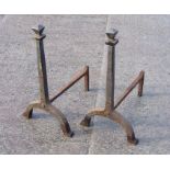 A pair of steel andirons