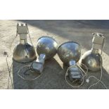 A set of four Thorlux metal industrial style pendant ceiling lights with glass shades, Cat. No.