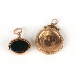 A Victorian 9ct gold back-and-front locket with engraved decoration; together with a 9ct gold