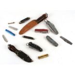 A quantity of items to include sheath knives; penknives; coinage; badge bar badges and miniature